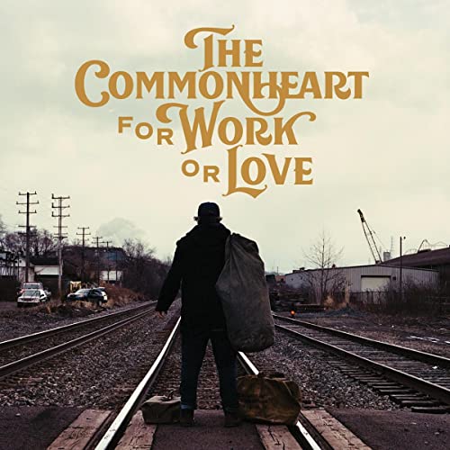 Vinyl album cover: man with bag walking on railroad tracks.