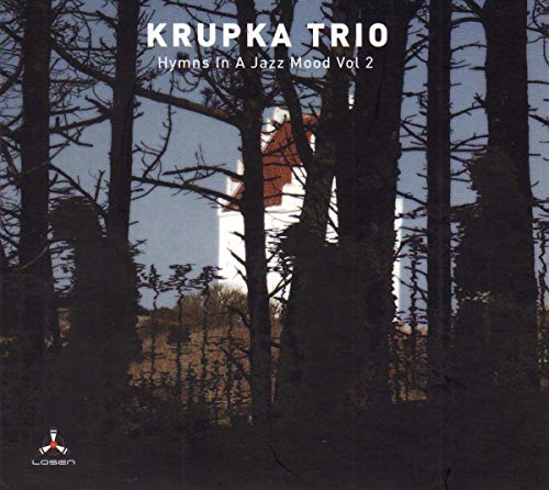 A white building viewed through dark tree silhouettes with album text overlaid.