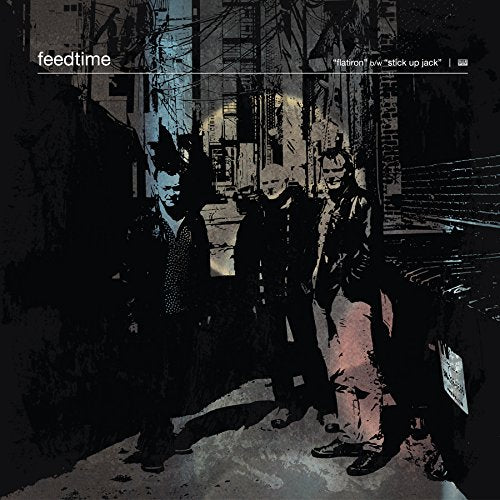 Feedtime album cover: grainy black and white image of three figures in a city.
