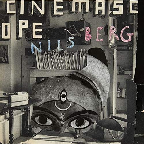 Vinyl record cover with surrealist collage of eyes and objects.