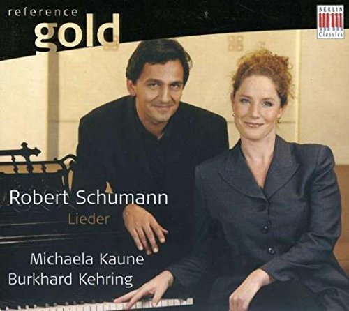 CD cover featuring a man and woman beside a piano, smiling.