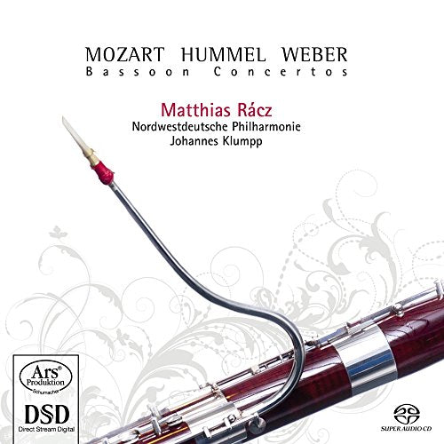 A bassoon is prominently displayed on a white background with floral designs.