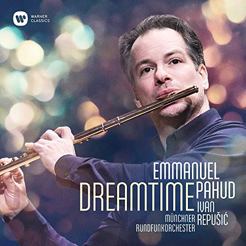 "CD cover featuring a man playing the flute with blurred lights in the background."