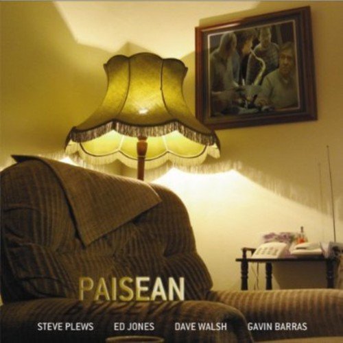 "Album cover featuring a dimly lit living room scene with a lamp and sofa."