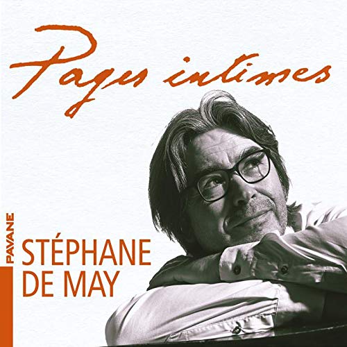 "Album cover featuring a black-and-white portrait of a man with glasses and orange text."
