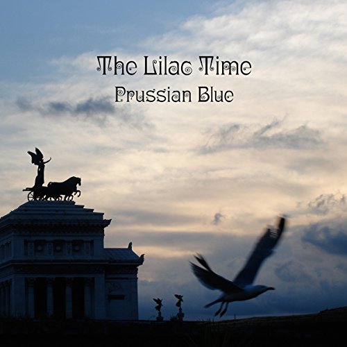 Album cover with a building, birds, and cloudy sky, featuring "The Lilac Time Prussian Blue".