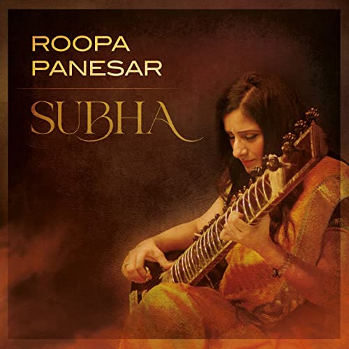 CD cover: Roopa Panesar playing a sitar, warm tones, portrait.