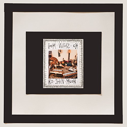 Framed vinyl record artwork with a collage of musical instruments.