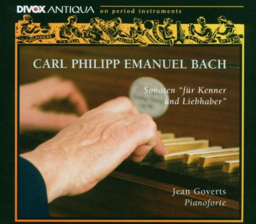 CD cover with a hand playing piano keys, dark green background, and decorative border.