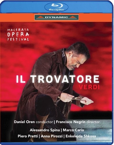 "Blu-ray case cover featuring a man in dark attire against a red background."