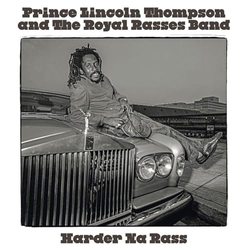 Black and white album cover featuring a man leaning on a car.