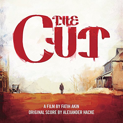 "Album cover for 'The Cut' with red title, man standing between old buildings."