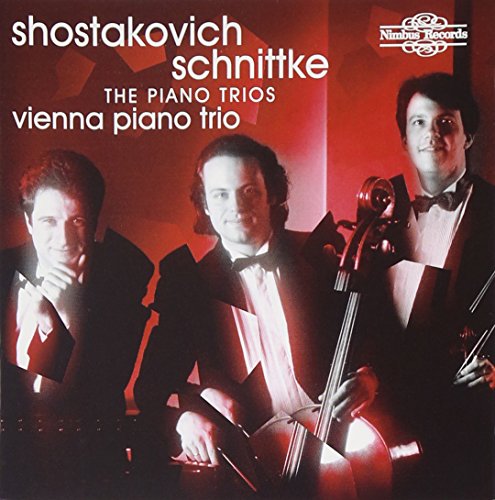 "CD cover featuring three men in tuxedos holding musical instruments against a red background."