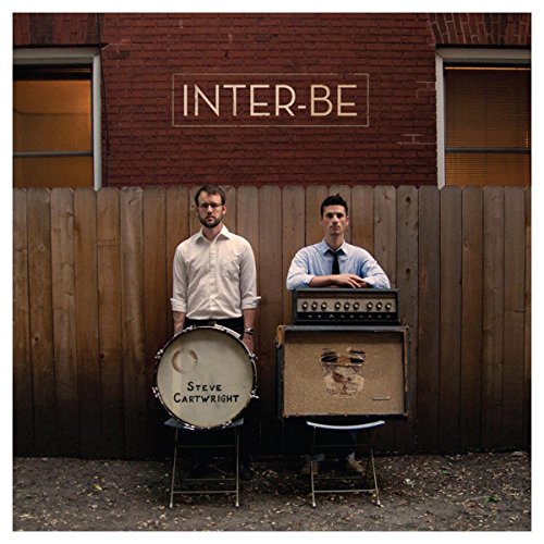 Album cover for Peter Wolf Crier's "Inter-Be" featuring two men and musical equipment.