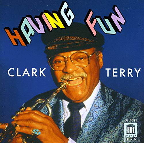 Clark Terry portrait with trumpet, wearing a hat and glasses.