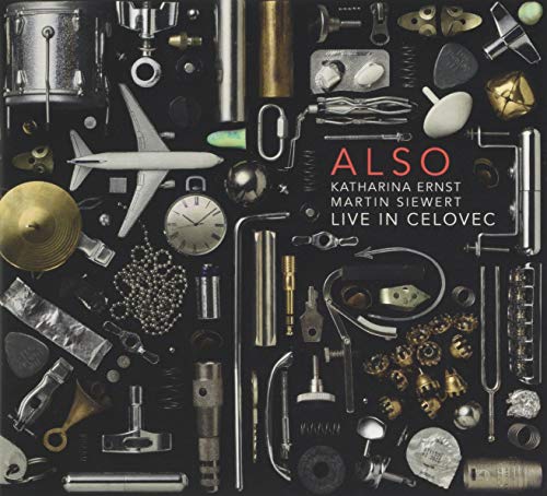 CD cover with collage of various small metallic objects on black background.