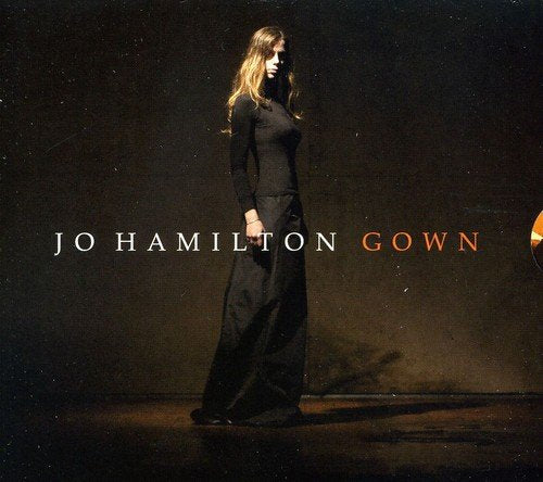 Album cover featuring a woman in a long black dress against a dark background.