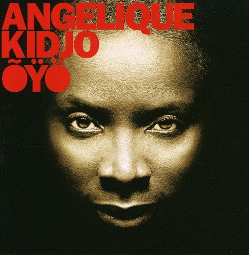 "Album cover featuring a close-up of a woman's face with red text."