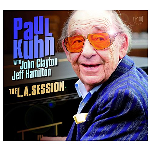 Album cover featuring an older man in a blue jacket with orange-tinted glasses.