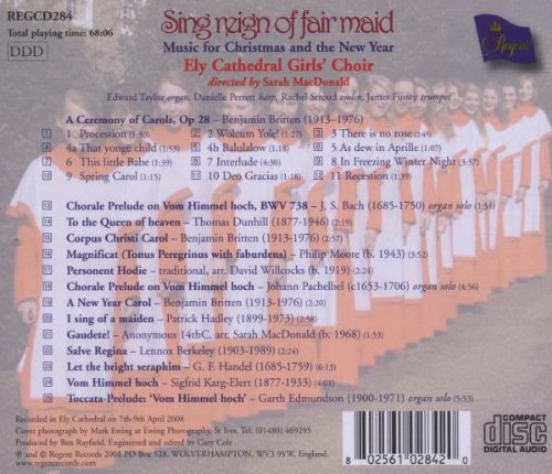 "CD cover featuring a group of girls in white and red robes standing before a Christmas tree."