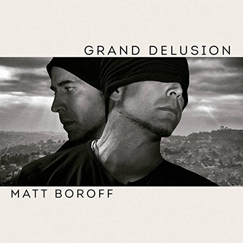 Black and white album cover with a man wearing a beanie, back-to-back with his reflection.