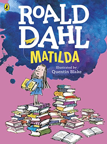 "Book cover of 'Matilda' by Roald Dahl, featuring a girl surrounded by piles of books."