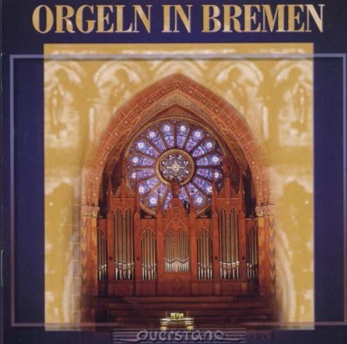 CD cover featuring a large pipe organ before a stained glass window.