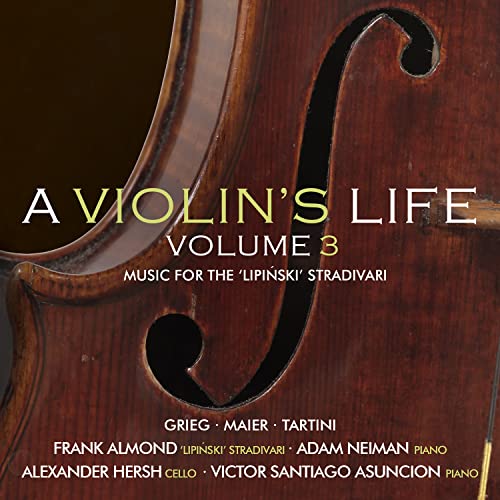 Close-up of a varnished violin with text overlay: "A Violin's Life, Volume 3.