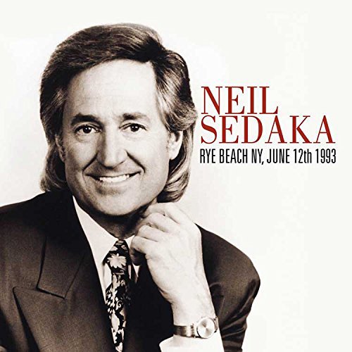Black and white portrait of Neil Sedaka with album title text.