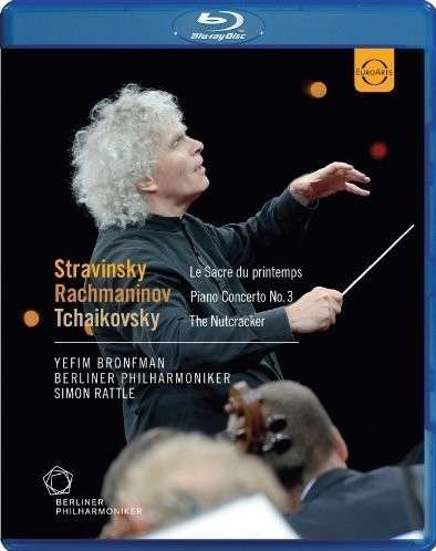 "Blue Blu-ray case cover featuring conductor Simon Rattle with baton and musicians."