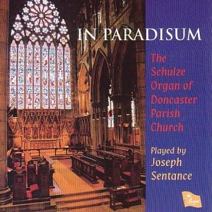 "CD cover featuring a church interior with stained glass and text on blue panel."
