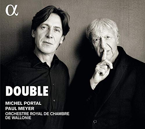Black and white image of two men, one making a "shh" gesture, on a CD cover.