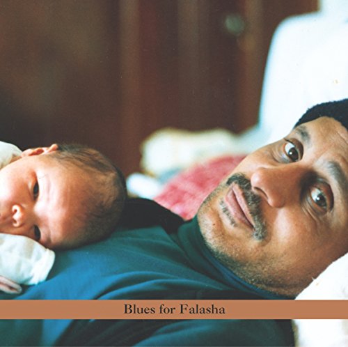 "CD cover with man holding baby, 'Blues for Falasha' text on brown banner."