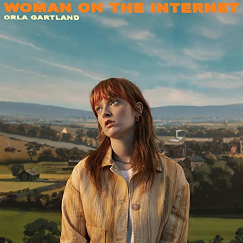 CD cover featuring a woman with red hair looking upwards at a landscape.