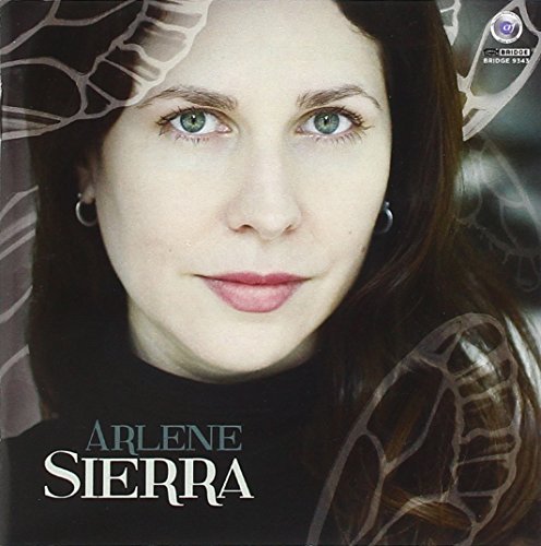 "Album cover with a close-up portrait of a woman with green eyes and brown hair."