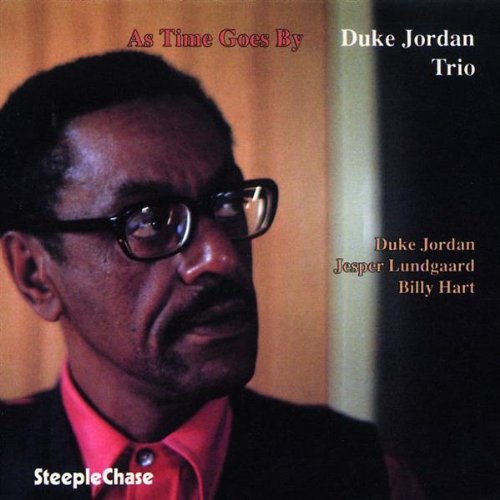 "CD cover with a man wearing glasses, title 'As Time Goes By' and 'Duke Jordan Trio'."