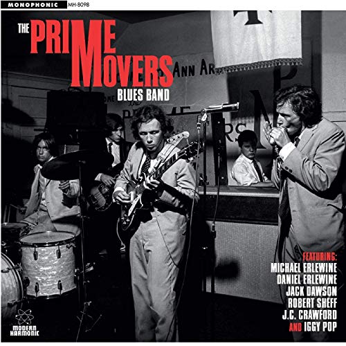 "Album cover featuring a black-and-white photo of a band performing on stage."