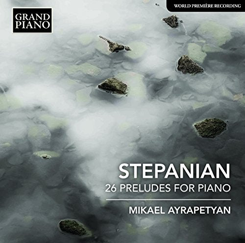 "CD cover with foggy landscape, piano preludes title, and artist name."