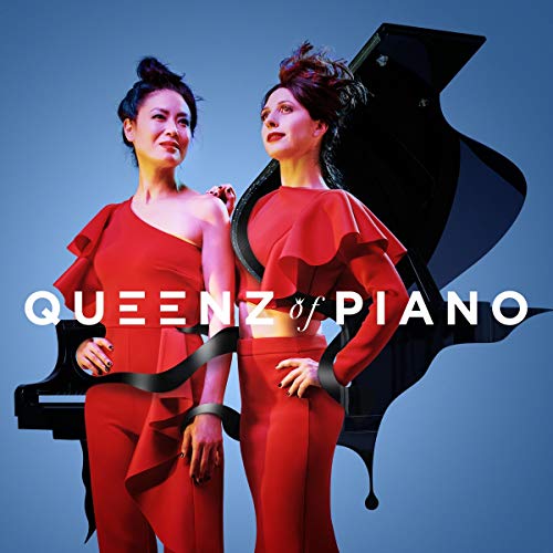 "Album cover featuring two women in red outfits with a grand piano behind them."