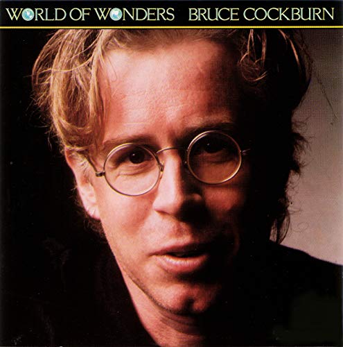 Vinyl record cover with a close-up portrait of Bruce Cockburn wearing round glasses.