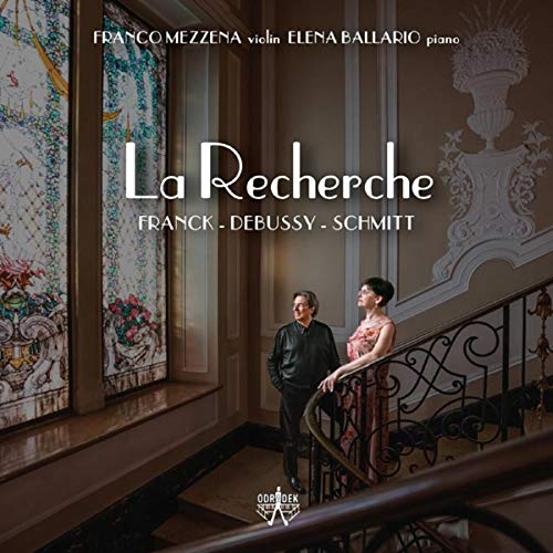 "Album cover featuring a man and woman on a grand staircase."