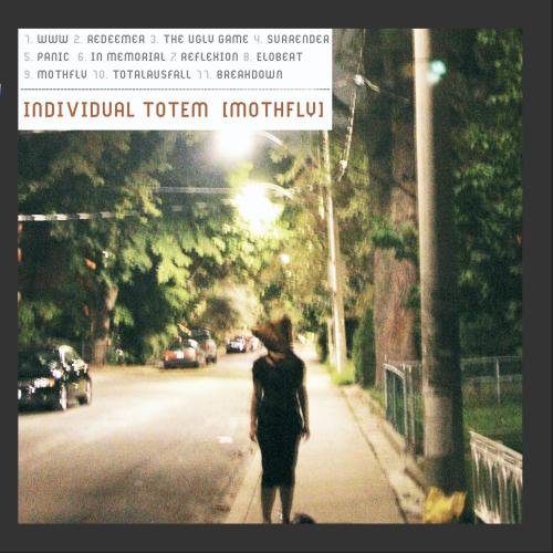 CD cover: person with moth-like head standing on a dark street.