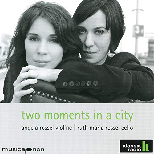 CD cover with two women in black and white, green text "two moments in a city".
