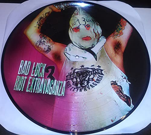 Vinyl record featuring a masked figure with tattoos, text "Bad Luck Riot Extravaganza".