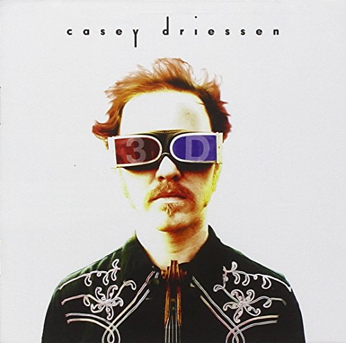 Man with red hair wearing 3D glasses, album cover art.
