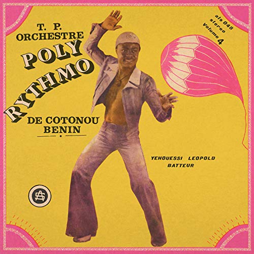 Vinyl record cover featuring a musician in a yellow suit, mid-performance.