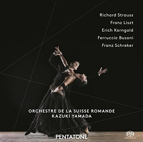 "Dancers in black costumes on a stage, with white text on a black background."