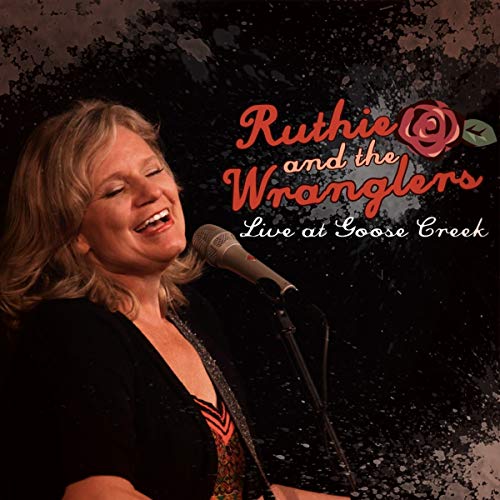 CD cover featuring a smiling woman singing into a microphone.