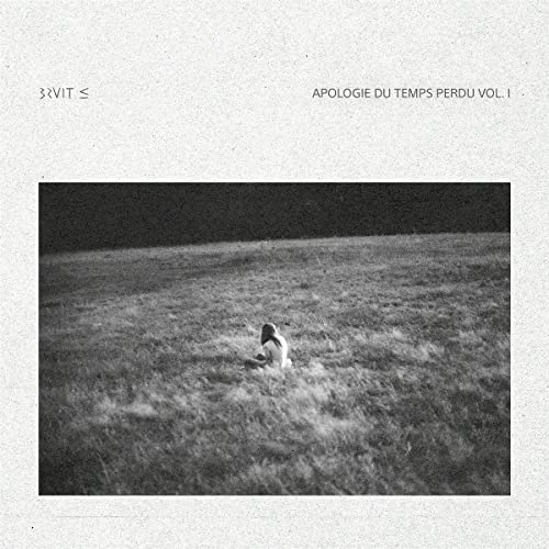 Vinyl album cover: a lone figure in a grassy field, monochrome.