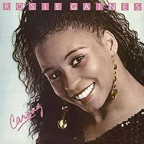 CD cover featuring a smiling Black woman with curly hair and gold earrings.